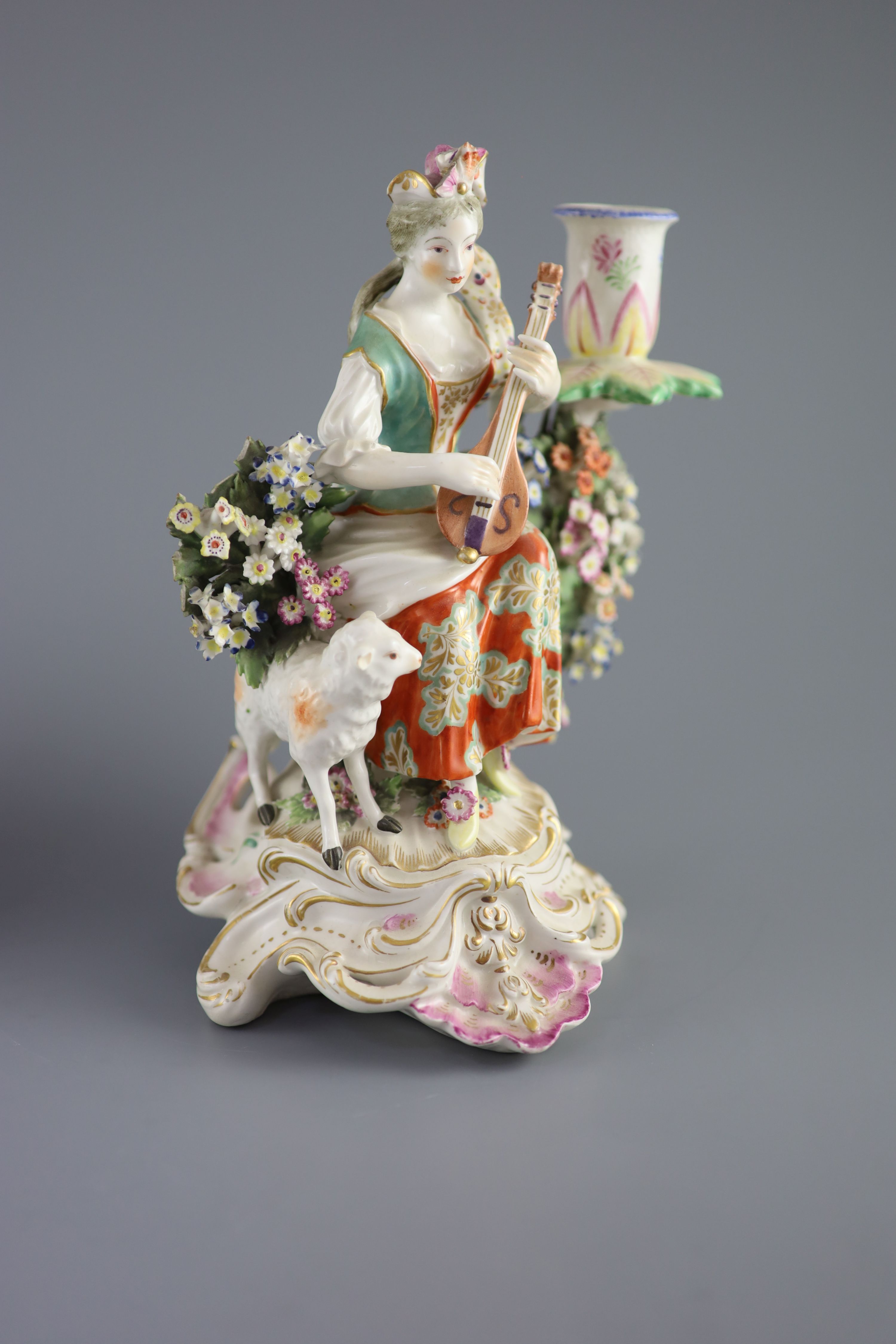 A pair of Chelsea Derby musician candlestick figures, c.1770, 22.5 cm high